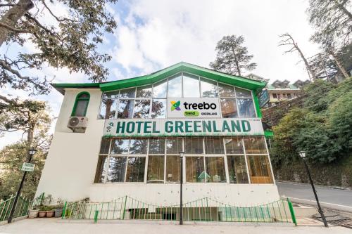 a building with a sign that reads hotel greenland at Treebo Trend Greenland - Mall Road in Shimla