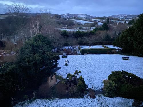 an aerial view of a garden in the snow at Penralley House B&B in Rhayader