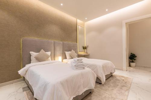 Postel nebo postele na pokoji v ubytování Amber Hospitality - Al Qairawan