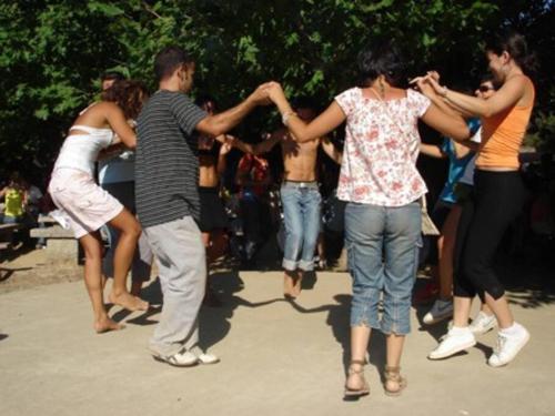 a group of people dancing in a park at Great stay & beautiful trails in Raches