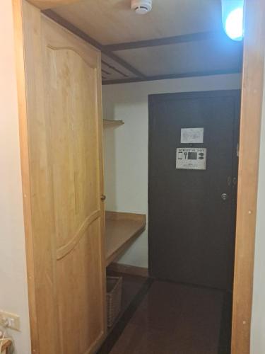 a room with a door and a room with a stairway at Presidency Towers,Kochi in Cochin