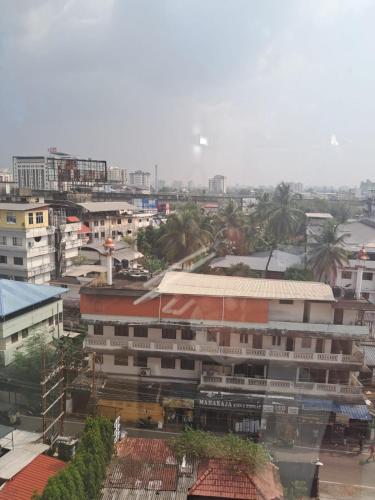 a view of a city with buildings and trees at Presidency Towers,Kochi in Cochin