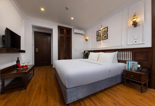 Ένα ή περισσότερα κρεβάτια σε δωμάτιο στο Paddy Hotel