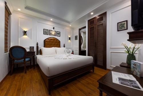 Ένα ή περισσότερα κρεβάτια σε δωμάτιο στο Paddy Hotel