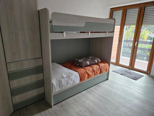 a bedroom with a bunk bed in a room at APPARTAMENTO IL VELINO in Rocca di Mezzo