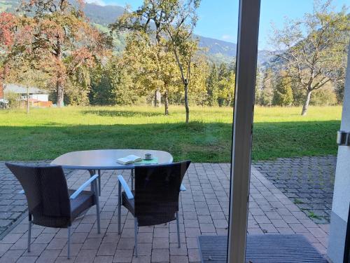 a white table and chairs sitting on a patio at Chalet Keßler in Tschagguns