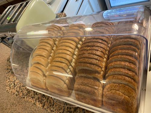 a plastic container of breads sitting on a counter at Hotel Nanni Garnì in Rimini