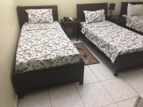 Ένα ή περισσότερα κρεβάτια σε δωμάτιο στο HOTEL IKRAM