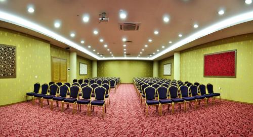 a conference room with chairs and a red carpet at Demosan Hotel in Karaman