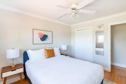 a white bedroom with a bed and a ceiling fan at Los Gatos 5br w backyard nr trails wineries SFO-1614 in Los Gatos
