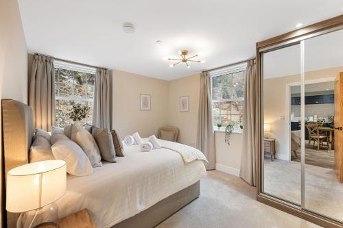 a bedroom with a large bed with a window at Rock Mill 25 in Stony Middleton