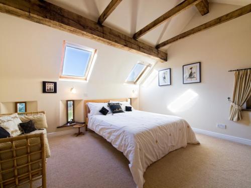 a bedroom with a large bed and windows at 2 bed in Barlow PK612 in Barlow