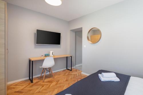 Телевизор и/или развлекательный центр в Solar Beach Inn