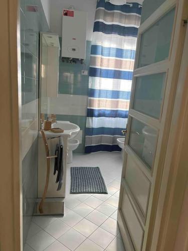 a bathroom with a shower and a sink and a toilet at Casa di Giulia in Viterbo