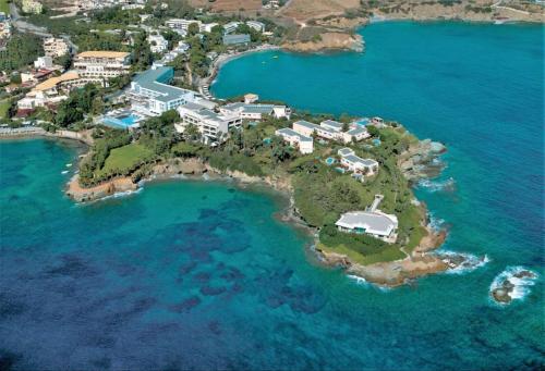 an aerial view of an island in the ocean at Out Of The Blue Resort & Spa in Agia Pelagia