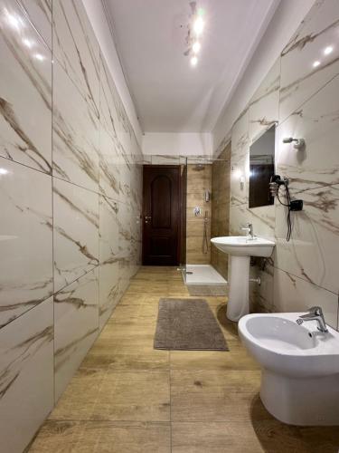 a bathroom with a sink and a mirror at La Via del Mare in Torre del Greco