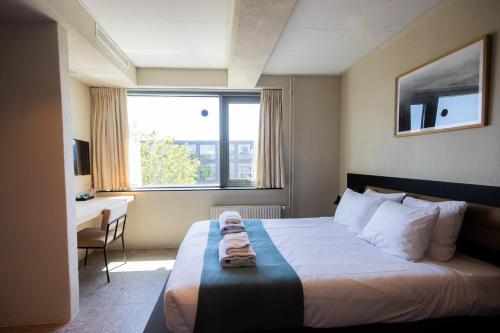 Ένα ή περισσότερα κρεβάτια σε δωμάτιο στο Rooms25