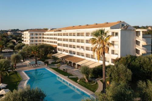 an aerial view of a hotel with a swimming pool at Elea Beach Hotel in Dassia