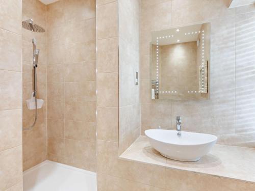 a bathroom with a sink and a shower at 2 Bed in Alnwick CN218 in Alnwick