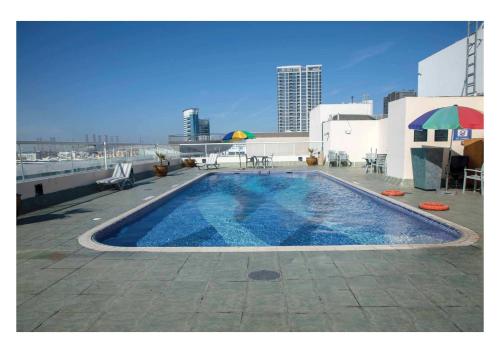 a swimming pool on the roof of a building at West Zone Plaza Hotel Apartment (Formerly Winchester Hotel Apts) in Dubai