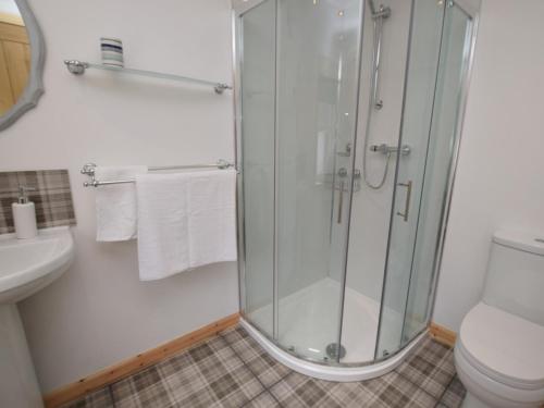 a bathroom with a shower and a toilet at 2 Bed in Avoch 73550 in Avoch