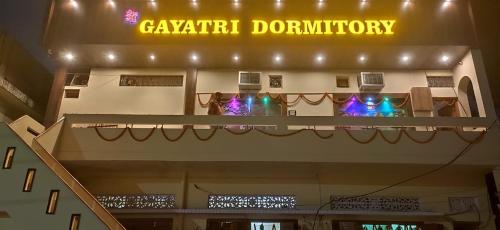 a balcony of a building with a sign that readsentaryliction at Maa Gayatri Dormitory in Varanasi