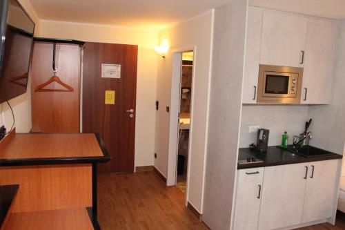 Kuchyň nebo kuchyňský kout v ubytování Landhotel Löwenbruch