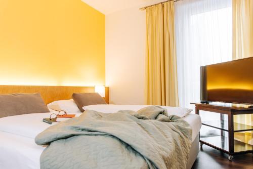 Postel nebo postele na pokoji v ubytování HEINhotel vienna airport