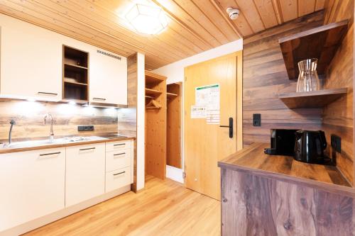 Cuisine ou kitchenette dans l'établissement Käserstube Ferienwohnungen