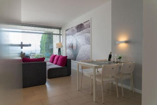 a living room with a table and a couch at VacationClub – Bukowa 17 Apartament B.2 in Wisła