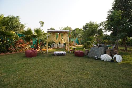 a yard with a gazebo and a tent at Castle Oodeypore A Boutique stay Udaipur in Udaipur