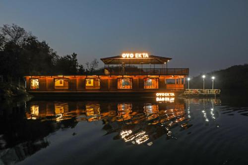 a boat on the water at night at Ekta Houseboat Statue Of Unity Kevadia in Vadodara