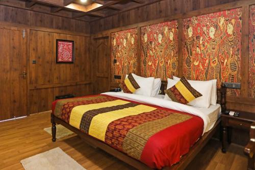 a bedroom with a bed in a room with wooden walls at Ekta Houseboat Statue Of Unity Kevadia in Vadodara