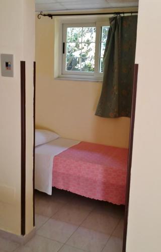 Ένα ή περισσότερα κρεβάτια σε δωμάτιο στο B&B Baia dello Stretto