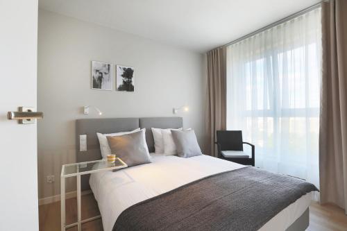 Posteľ alebo postele v izbe v ubytovaní Apartamenty Jozefina