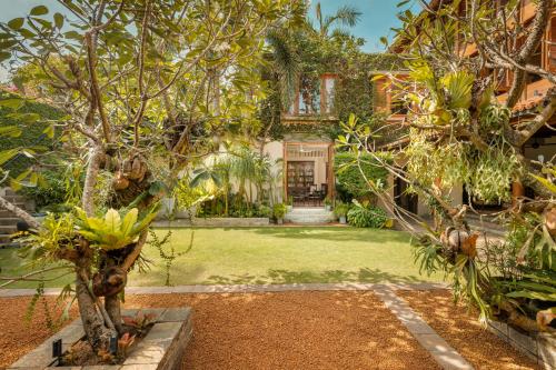 an exterior view of a house with trees in the yard at Ishq Colombo in Colombo