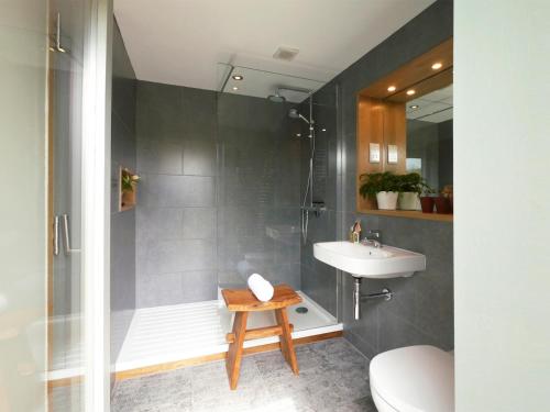 a bathroom with a shower and a sink and a toilet at 1 Bed in Goathland G0157 in Goathland