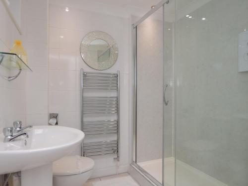 a bathroom with a shower and a sink and a toilet at 2 Bed in Westward Ho 73857 in Westward Ho