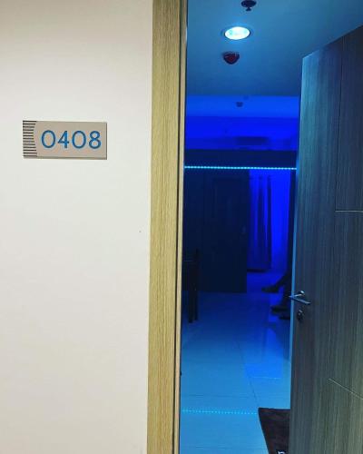 an open door to a room with a sign on it at 4Brother's Staycation by Jessika in Manila