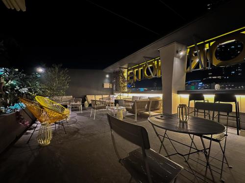 a restaurant with tables and chairs at night at Randor Hotel Hiroshima Prestige in Hiroshima