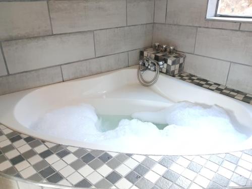 a bath tub filled with lots of snow at The Crooked Forest in Pretoria