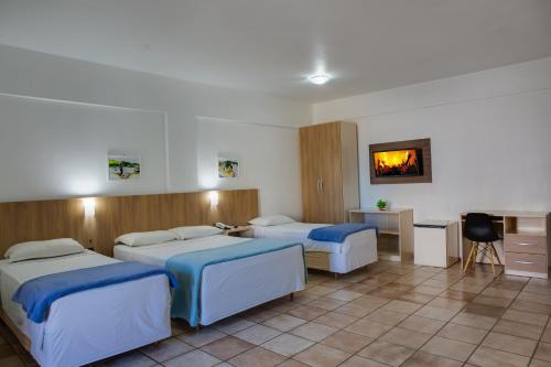 Katil atau katil-katil dalam bilik di Flipper Hotel