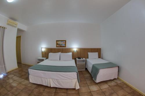Katil atau katil-katil dalam bilik di Flipper Hotel