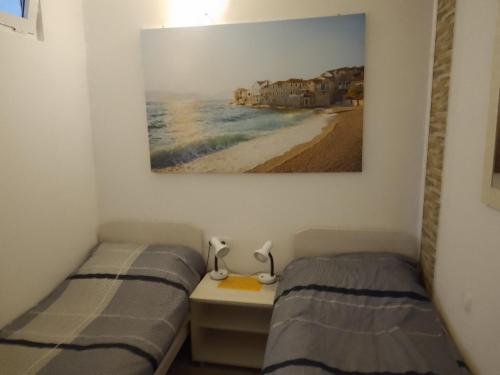 Postel nebo postele na pokoji v ubytování Mladen Vodice