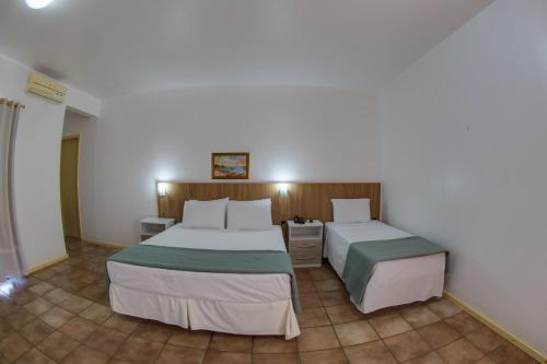 Katil atau katil-katil dalam bilik di Flipper Hotel