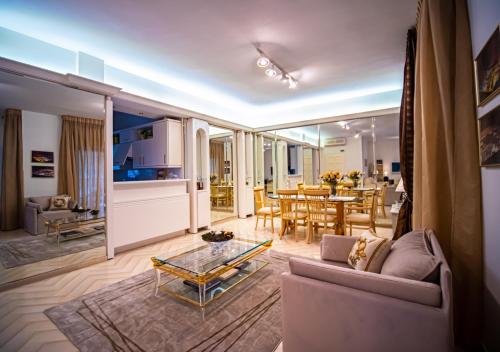 a living room with a couch and a table at Yianni's Home-Comfort Apartment in Volos in Volos