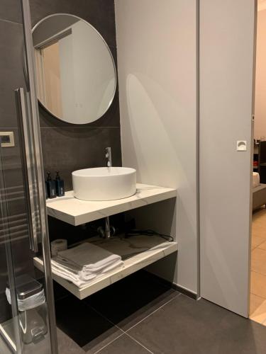 a bathroom with a sink and a mirror at Spazio SIMA Space 2 - 2 in Milan