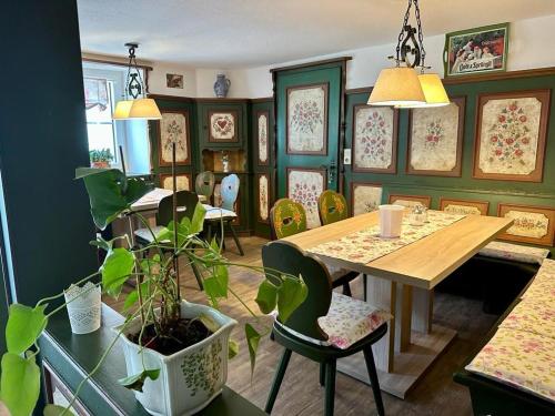 a dining room with a table and chairs at Chalet MOOS in Todtmoos