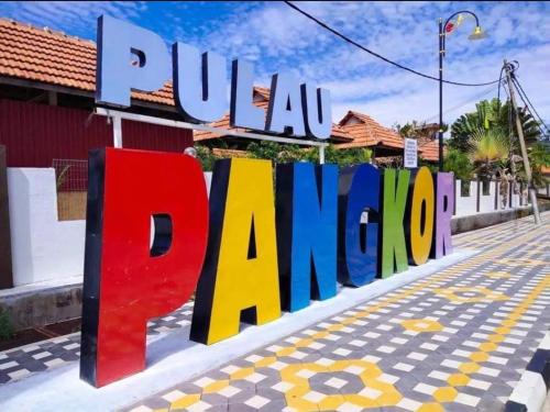 a sign that reads punal jamuna on a street at Pangkor BeachWalk Studio in Pangkor
