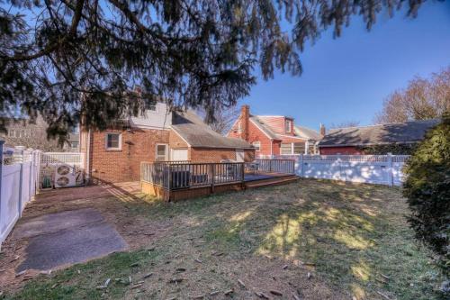 an empty yard in front of a house at Family Home near NY Beach - Private Workspace in Glen Head